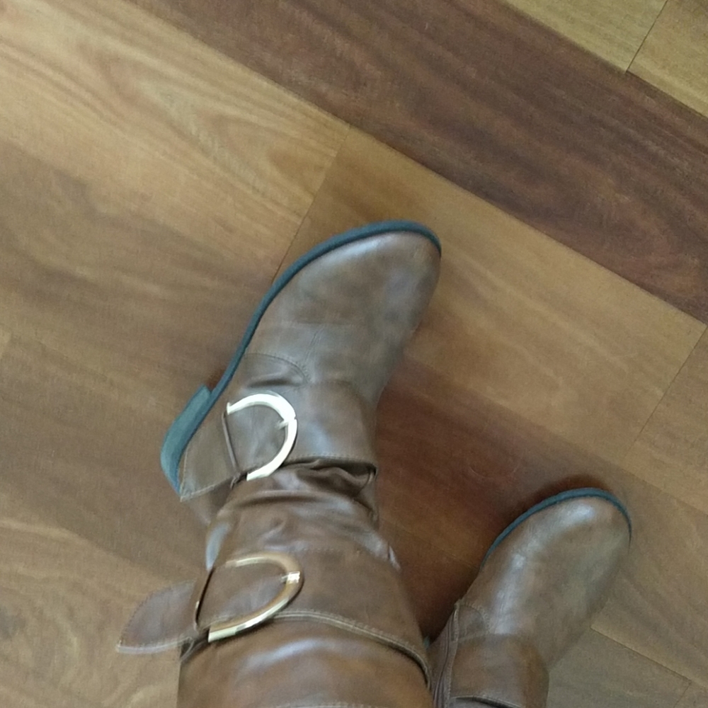 Brown tall boots with buckles